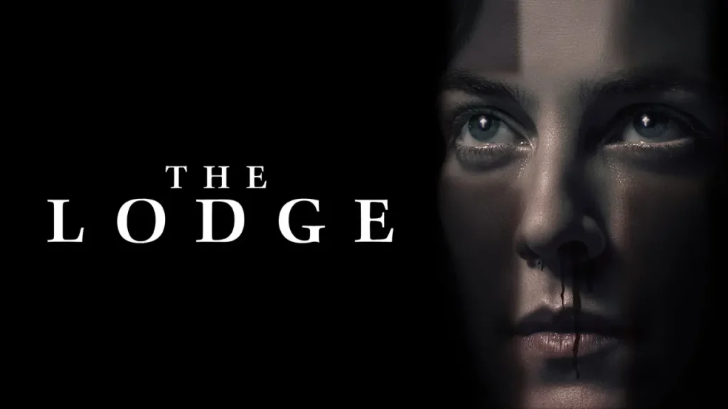 Psychological horror movie poster for The Lodge (2019), showing a close-up of a woman's pale face, haunting blue eyes, and blood dripping from her nose.