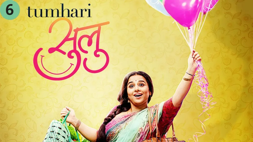 Bright yellow movie poster of Tumhari Sulu (2017), featuring Vidya Balan smiling in a saree while holding colorful balloons and shopping bags.